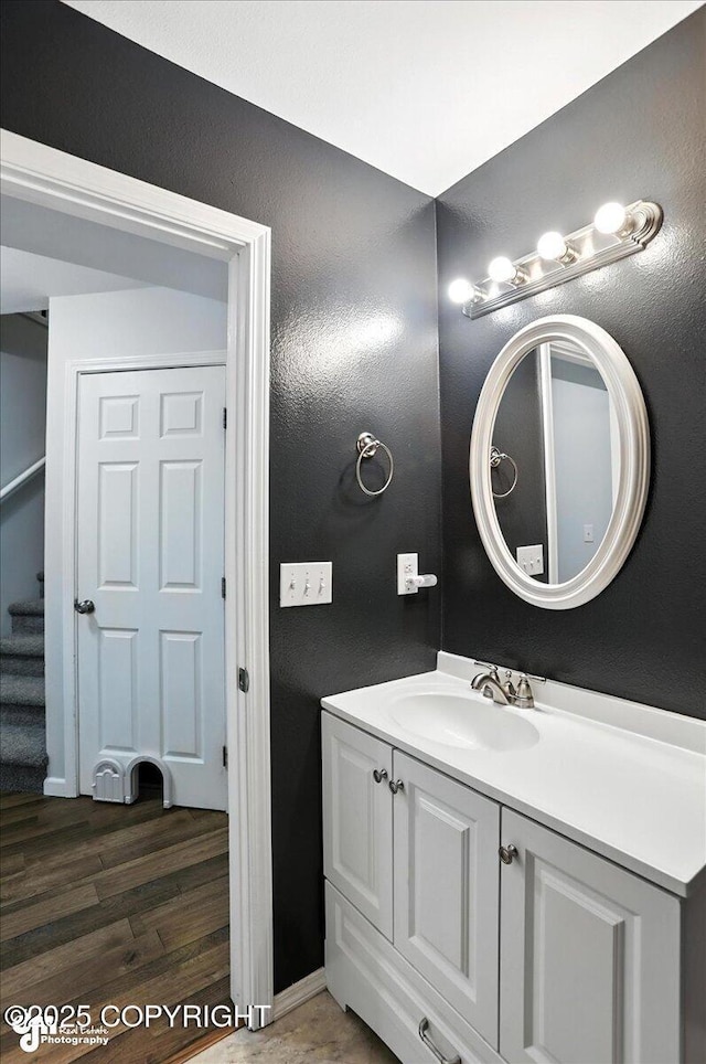 21009 River Park Dr, Eagle River, AK 99577 - bathroom featuring vanity and wood finished floors