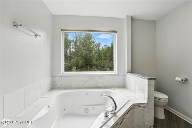 21009 River Park Dr, Eagle River, AK 99577 - bathroom with a jetted tub and wood finished floors