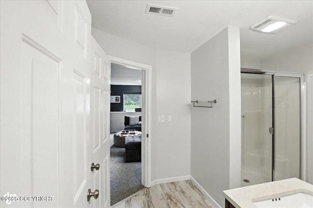 21009 River Park Dr, Eagle River, AK 99577 - full bathroom with a stall shower, marble look tile flooring, and vanity