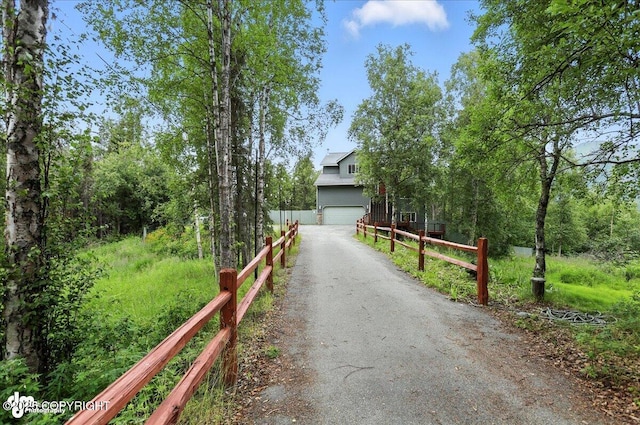 21009 River Park Dr, Eagle River, AK 99577 - view of front of home featuring driveway and an attached garage