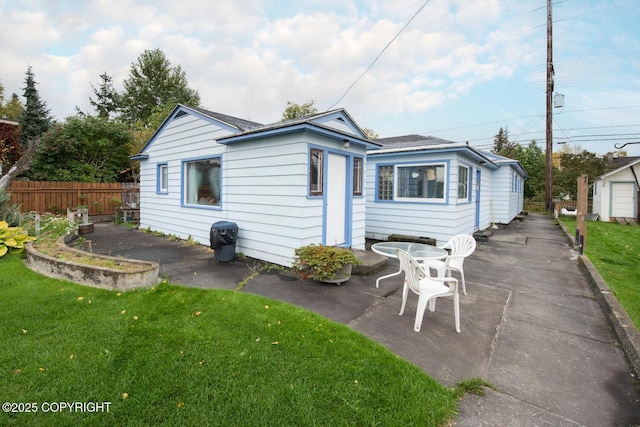 318 W 10th Ave, Anchorage, AK 99501 - back of house featuring a patio