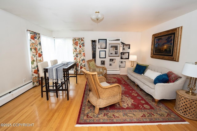 326 W 10th Ave, Anchorage, AK 99501 - living room featuring wood finished floors and a baseboard radiator