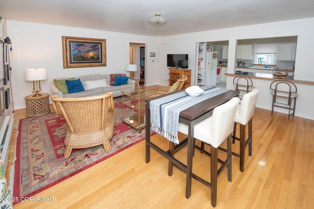 326 W 10th Ave, Anchorage, AK 99501 - living room featuring light wood finished floors