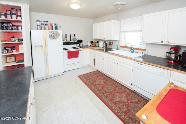 326 W 10th Ave, Anchorage, AK 99501 - kitchen with white appliances, white cabinets, light flooring, and dark countertops