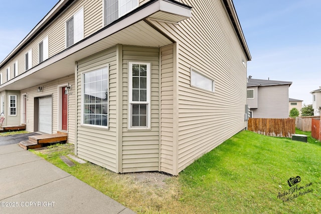 6507 Kara Sue Loop # 83, Anchorage, AK 99504 - view of side of home featuring an attached garage