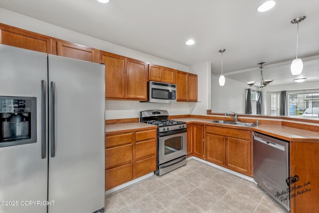 6507 Kara Sue Loop # 83, Anchorage, AK 99504 - kitchen with stainless steel appliances, a peninsula, brown cabinets, light tile patterned floors, and pendant lighting