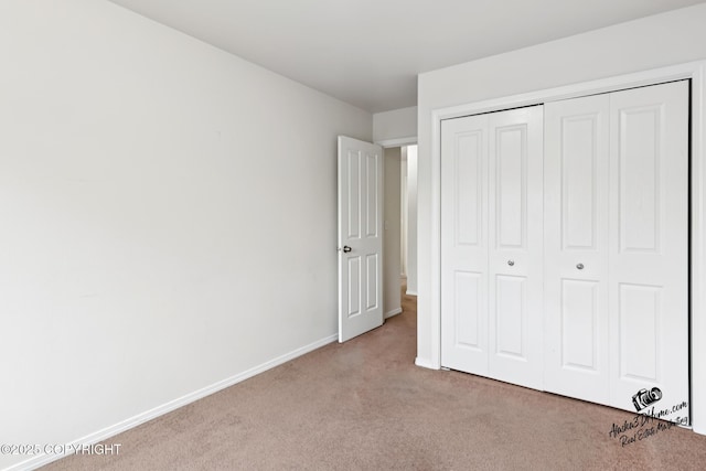 6507 Kara Sue Loop # 83, Anchorage, AK 99504 - unfurnished bedroom featuring carpet and a closet