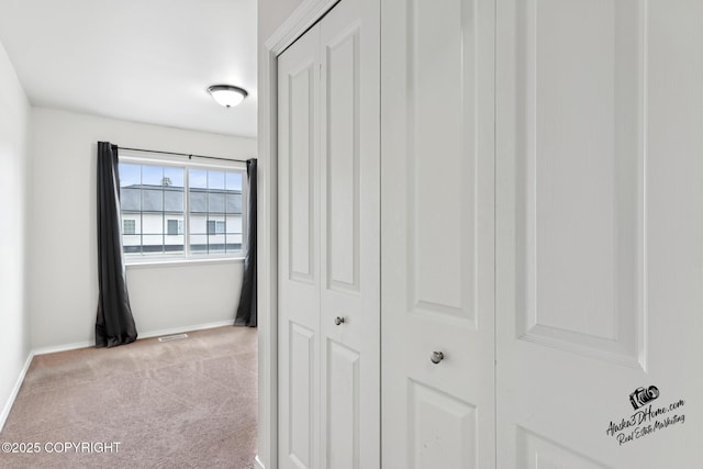 6507 Kara Sue Loop # 83, Anchorage, AK 99504 - hallway featuring baseboards and carpet floors
