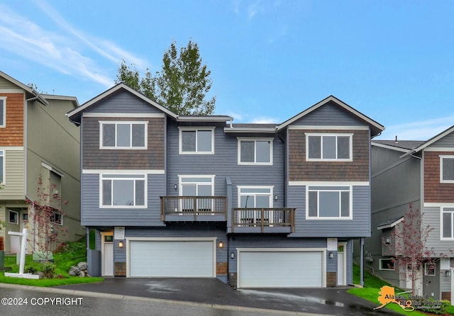 12229 Vista Ridge Loop, Eagle River, AK 99577 - view of front of house featuring a garage and asphalt driveway