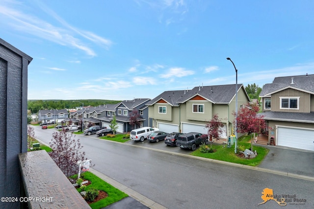 12229 Vista Ridge Loop, Eagle River, AK 99577 - view of asphalt street with a residential view and street lighting
