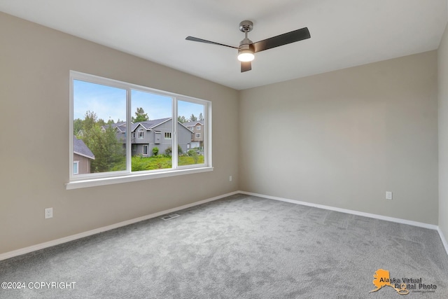 12229 Vista Ridge Loop, Eagle River, AK 99577 - empty room featuring carpet and a ceiling fan