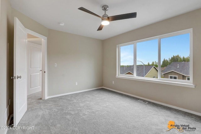 12229 Vista Ridge Loop, Eagle River, AK 99577 - carpeted spare room featuring ceiling fan and baseboards