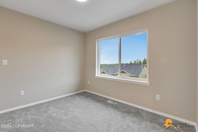 12229 Vista Ridge Loop, Eagle River, AK 99577 - unfurnished room featuring baseboards and carpet floors