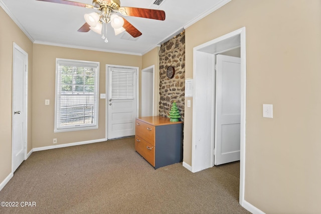 interior space featuring dark colored carpet, ceiling fan, and crown molding