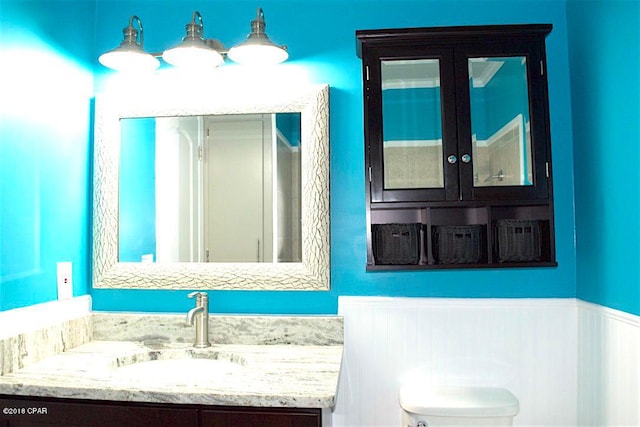 bathroom with toilet and vanity