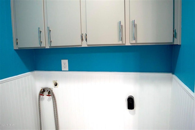 laundry room with cabinets