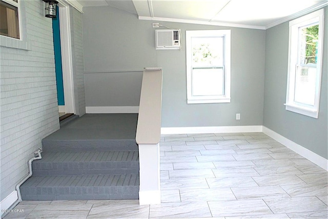 stairs featuring light tile flooring, an AC wall unit, ornamental molding, and vaulted ceiling