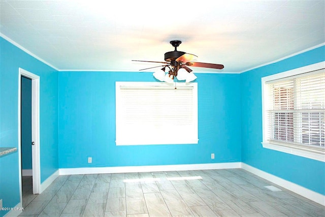 empty room featuring light hardwood / wood-style floors, ceiling fan, and crown molding