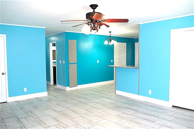 unfurnished room featuring ceiling fan with notable chandelier and ornamental molding