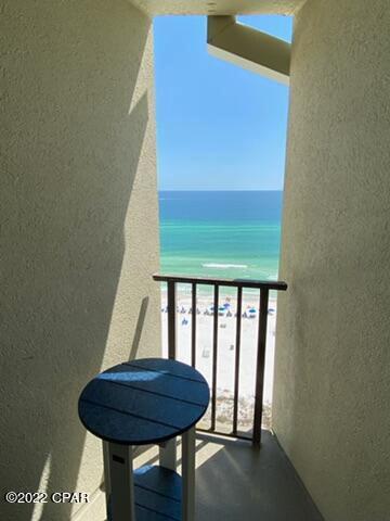 4715 Thomas Dr Unit E-13, Panama City Beach, FL 32408 - balcony featuring a beach view and a water view
