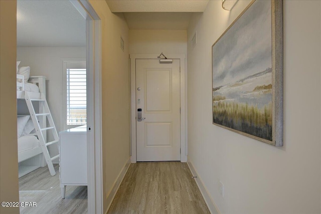 corridor featuring light hardwood / wood-style flooring