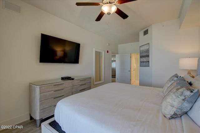 bedroom with ceiling fan and light hardwood / wood-style flooring