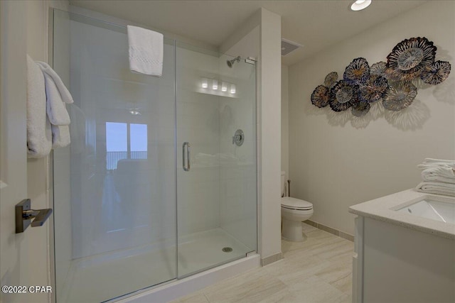 bathroom featuring an enclosed shower, toilet, vanity, and tile flooring