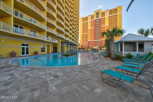 view of swimming pool with a patio