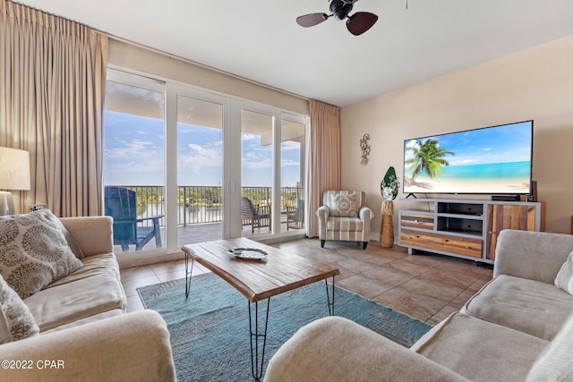 living room with ceiling fan and light tile floors