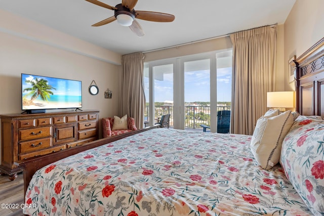 bedroom featuring access to outside, ceiling fan, and hardwood / wood-style floors