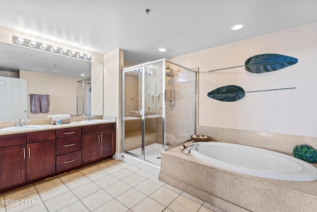 bathroom featuring double vanity, separate shower and tub, and tile floors