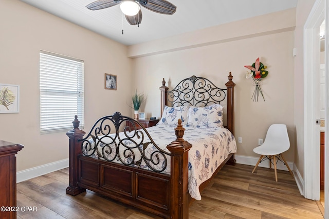 bedroom with ceiling fan and hardwood / wood-style flooring