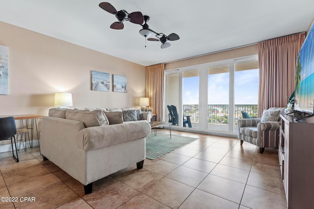 tiled living room featuring ceiling fan