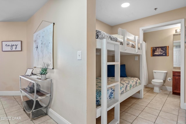 bedroom featuring light tile floors