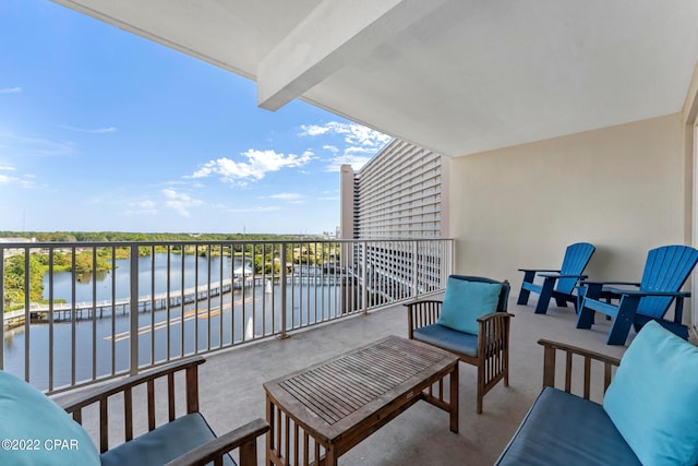 balcony featuring a water view