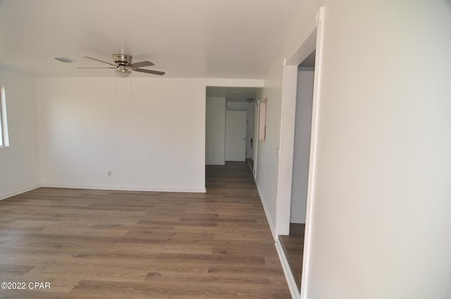 interior space featuring ceiling fan and dark wood-type flooring