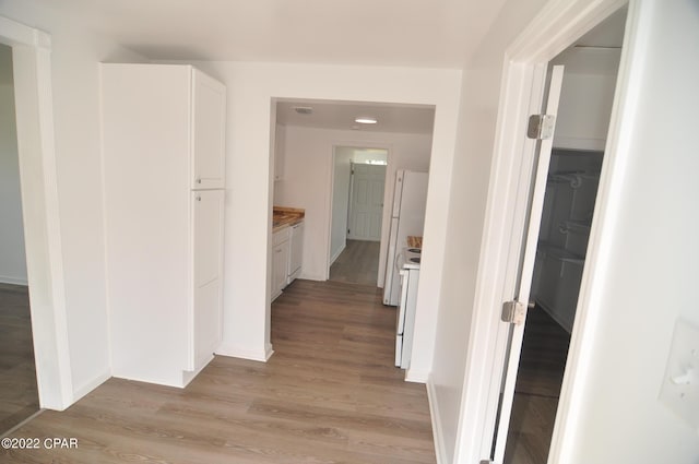 hallway featuring light wood-type flooring