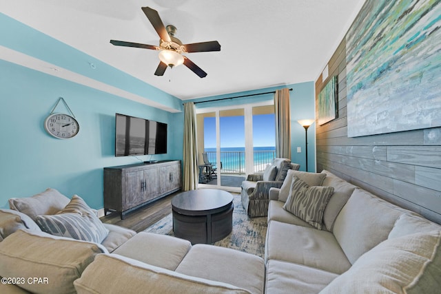 living room featuring hardwood / wood-style floors and ceiling fan