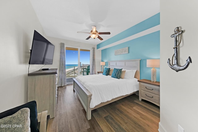 bedroom featuring ceiling fan, dark hardwood / wood-style floors, and access to outside