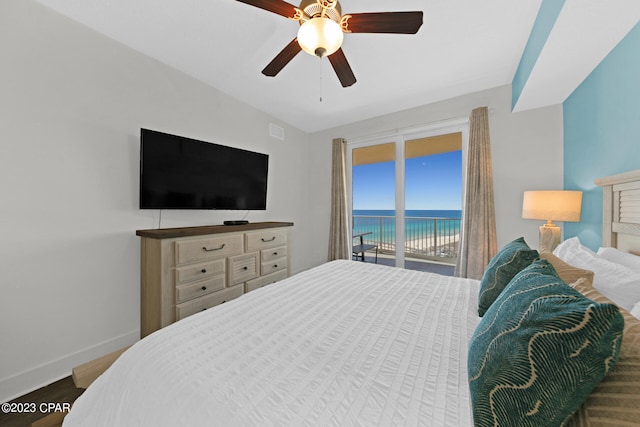 bedroom featuring lofted ceiling, access to exterior, ceiling fan, and dark hardwood / wood-style floors