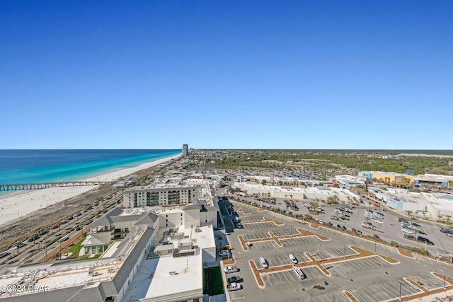 drone / aerial view featuring a water view and a beach view