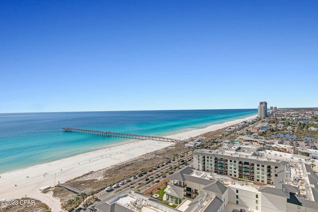 bird's eye view featuring a view of the beach and a water view