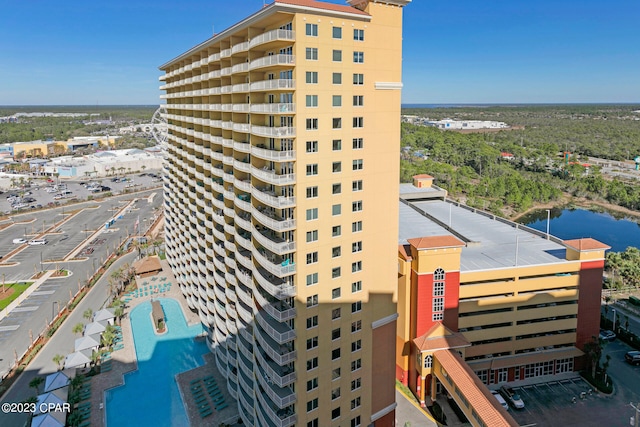 view of building exterior with a swimming pool