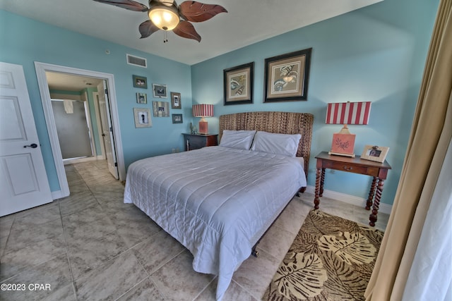 tiled bedroom with ceiling fan