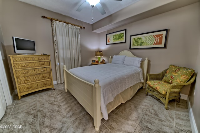 bedroom with light tile floors and ceiling fan