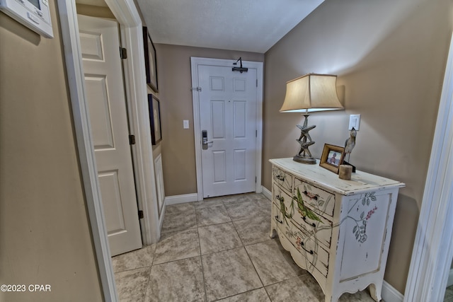 entryway featuring light tile flooring