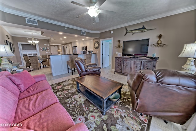 tiled living room featuring crown molding, a textured ceiling, and ceiling fan with notable chandelier