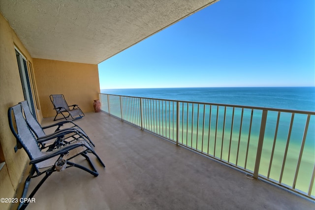 balcony featuring a water view