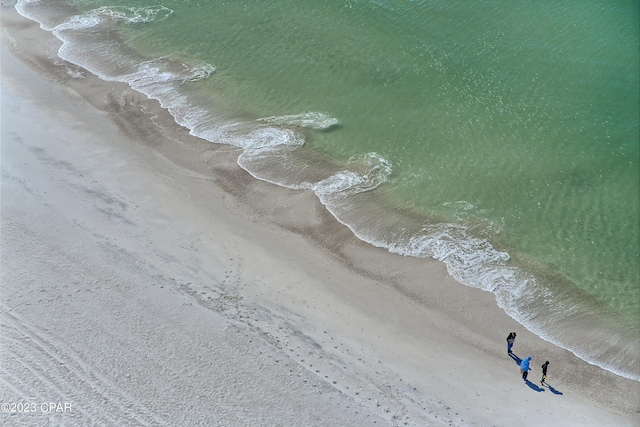 aerial view featuring a water view and a view of the beach