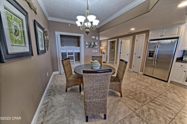 tiled dining area featuring a textured ceiling, a chandelier, and ornamental molding